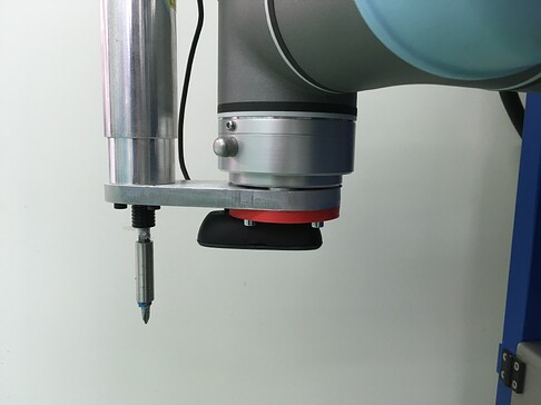 Figure 2: End effector includes a camera and screwing system