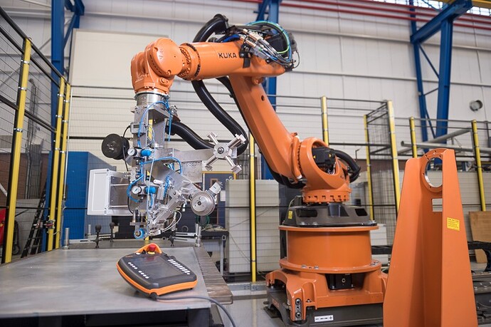 Robotic arm with tape laying tool attached
